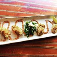 Fried Oysters · 5 lightly fried cold water oysters. Served with homemade Cajun remoulade sauce.