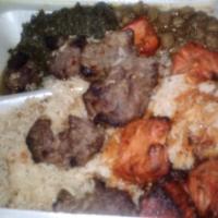 Lamb Kabob · Marinated chunks of lamb cooked on charcoal. Kabobs are served with rice chickpeas and spina...