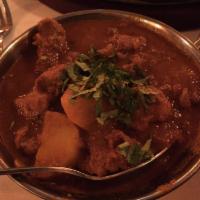 Lamb Vindaloo · Highly seasoned boneless lamb dish made with spicy tangy sauce, potatoes and spices.