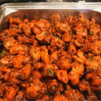 Chicken 65 · Boneless chicken cooked with mustard seeds, curry leaf, soya sauce, ketchup, Worcestershire ...