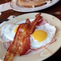 Hungry Man Breakfast · Homemade challah French toast, Belgian waffle or buttermilk pancakes with two eggs any style...