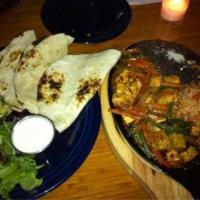 Fajitas · Fresh vegetable medley with your choice of filling. Served on a hot skillet with 3 flour tor...