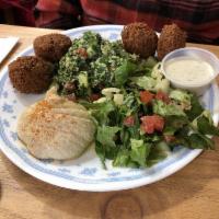 Falafel Plate · Vegetarian chickpea croquettes served with tabbouleh, hummus and baba's salad. Served with r...