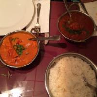 Chicken Vindaloo · Very hot, spiced chicken cooked with potatoes and a touch of vinegar. Served with basmati ri...