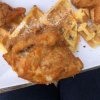Chicken and Waffles · Belgian waffle topped with 4 pieces of mixed fried bone-in chicken, topped with our homemade...