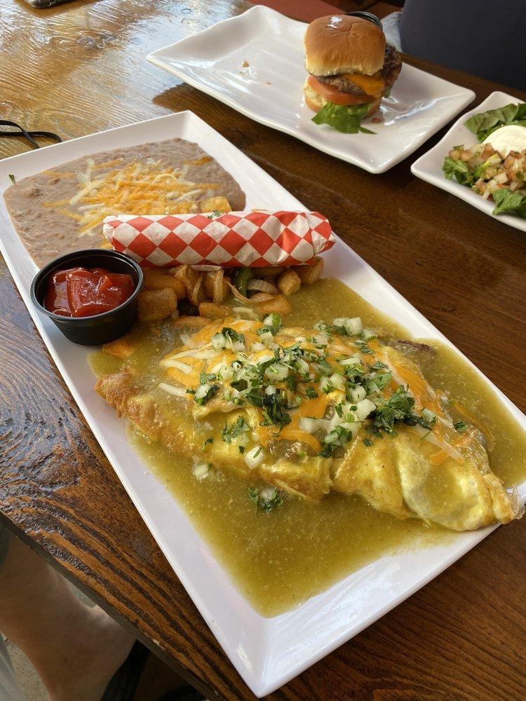 Chile Verde Omelette · 3 egg omelette, with carne asada, onion, smothered with our home made salsa verde topped with mixed cheese, served with beans and Maggie's potatoes.