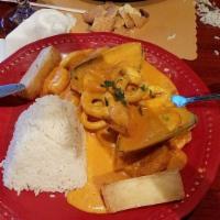 Pescado a Lo Macho · Fried fillet corvina served with a delicious seafood and lobster creamy sauce with yellow an...