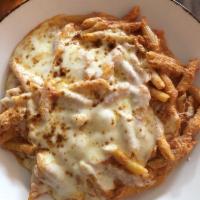 Baked Ziti Bolognese · Ziti pasta in a meat sauce mixed with ricotta cheese, topped with mozzarella  cheese and bak...