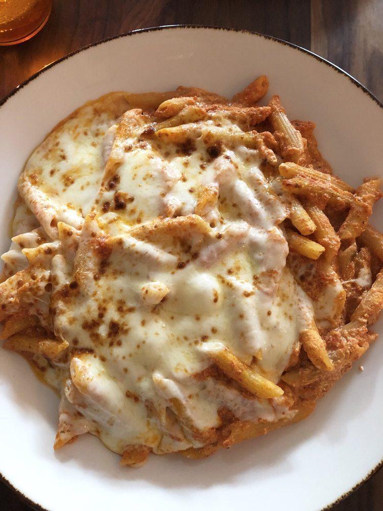 Baked Ziti Bolognese · Ziti pasta in a meat sauce mixed with ricotta cheese, topped with mozzarella  cheese and baked in the oven.