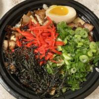 Chashu Bowl · House made sauteed chashu pork over rice.
Served with ginger, green onion, nori, and mirin a...