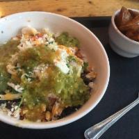 Green Bowl · Rice, frijoles negros, pulled rotisserie chicken, slaw, cotija cheese, salsa verde and salsa...