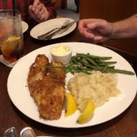 Parmesan Crusted Walleye · Golden fried fillet, green beans with toasted almonds, mashed potatoes, tartar sauce.