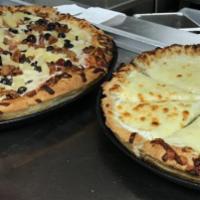 White Pizza · Ricotta, mozzarella, white cheddar, garlic and olive oil.