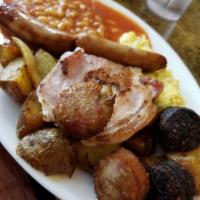Irish Breakfast · Served with 2 eggs, bacon, sausages, black and white pudding, baked beans, home fries and to...