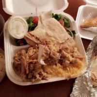 Chicken Shawarma · Thin slice of marinated chicken cooked on a slow revolving rotisserie served in a pita pocke...