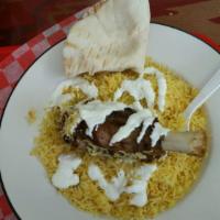 Lamb Shank · Served with basmati rice, green house salad, pita bread and sauce.