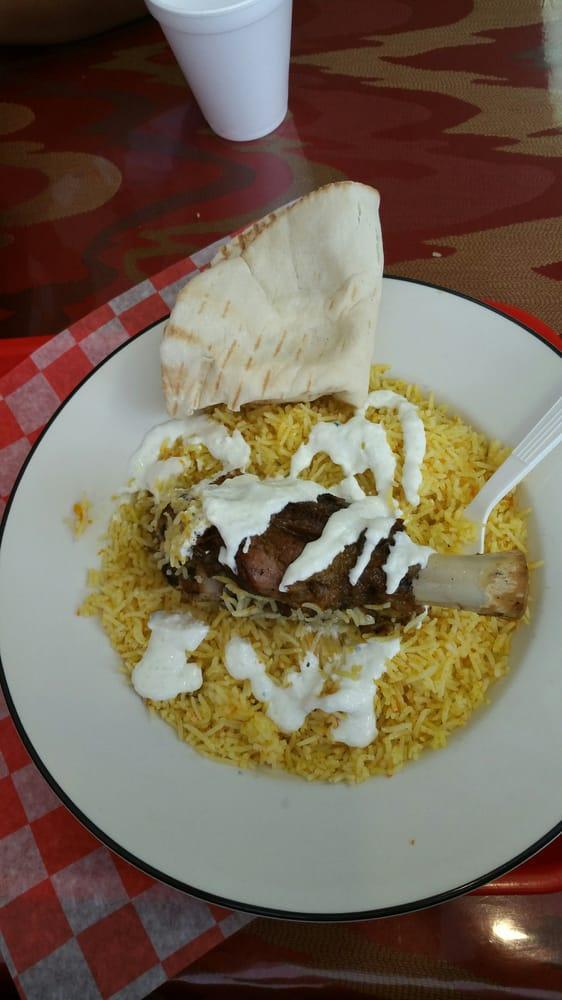 Lamb Shank · Served with basmati rice, green house salad, pita bread and sauce.