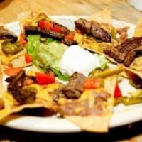 Fajitas · Choice of Beef, Chicken, or Mixed Fajitas. topped with onions and bell peppers. Served with ...