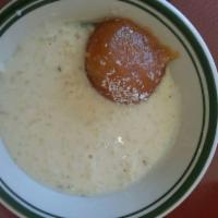 Gulab Jamun · Khoya delicacy stuffed with green cardamom powder and topped with coconut flakes or whipped ...