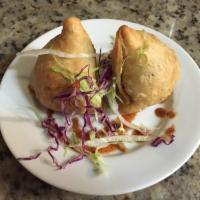 Vegetable Samosa · Mild spice potatoes and green peas wrapped in light pastry.3 pcs