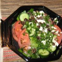 Tabouli Salad · Chopped parsley, cucumber, tomato, scallion, couscous, Kalamata olives, and feta cheese with...