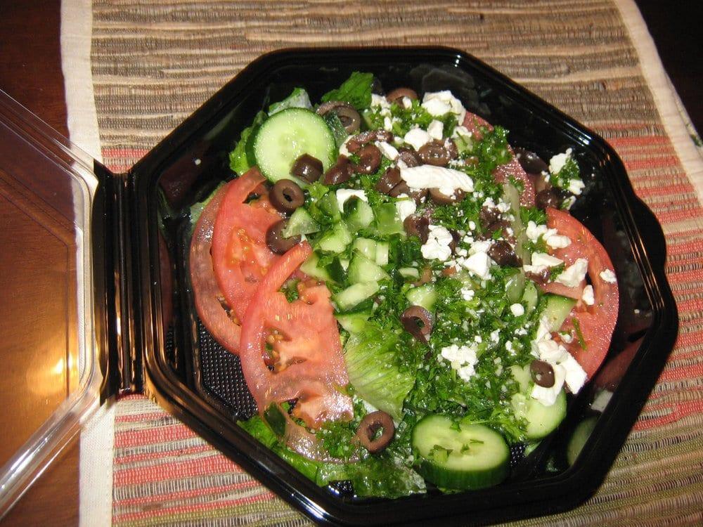 Tabouli Salad · Chopped parsley, cucumber, tomato, scallion, couscous, Kalamata olives, and feta cheese with lemon juice and extra virgin olive oil.