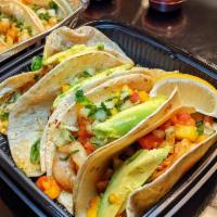 Cajun Shrimp Tacos · 4 tacos with flour tortillas filled with Cajun grilled shrimp and topped chipotle mango sauce.