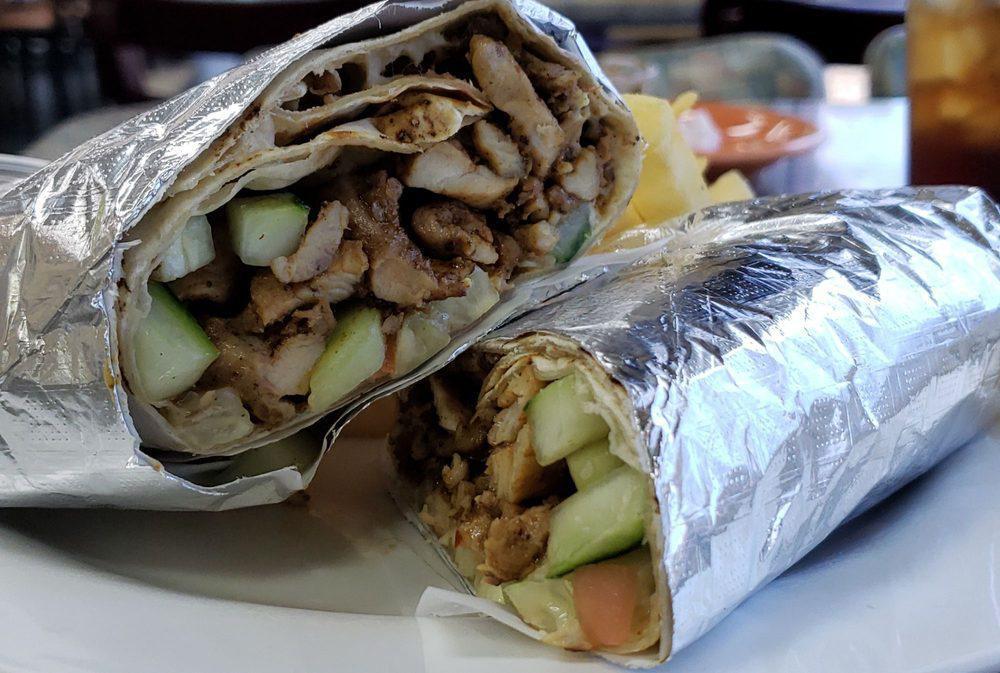 Shawarma · Served with hummus, rice and tomato and cucumber salad.