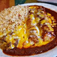 Two Cheese Enchiladas Dinner · Two enchiladas served with Spanish rice and refried beans.