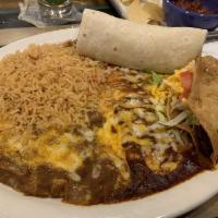 Cheese Enchilada and Taco Dinner · Taco, cheese and onion enchilada, and burrito of your choice served with rice and beans. 