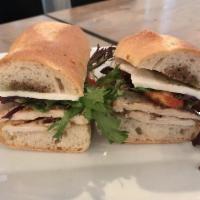 Martino · Grilled chicken, mozzarella,sundried tomatoes, baby greens, balsamic, basil oil