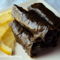 Dolma · 5 pieces. Grape leaves stuffed with rice, spices, and herbs. Halal.
