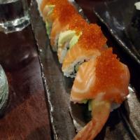 Orange Blossom Roll · Shrimp tempura, cucumber topped with salmon, avocado, tobiko.