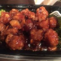 Crispy Orange Chicken · Chunks of chicken sauteed in rich brown sauce with orange peel. Spicy.