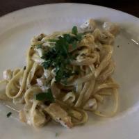 Fettuccine · Jumbo scallops, shrimp, chopped tomato, garlic, white wine ,sauteed with green and white fet...
