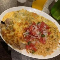 Smothered Burrito Platter · Flour tortilla rolled around with filling of choice, served with rice, beans and pico de gal...