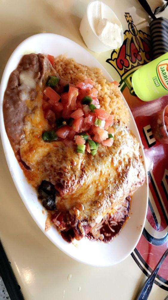 Enchiladas · 2 corn tortillas rolled filled out and cover with red sauce, melted cheese, rice, beans, pico de gallo and diced fresh onion.