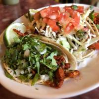 4 Al Pastor Tacos · Marinated pork. With cilantro and onions.