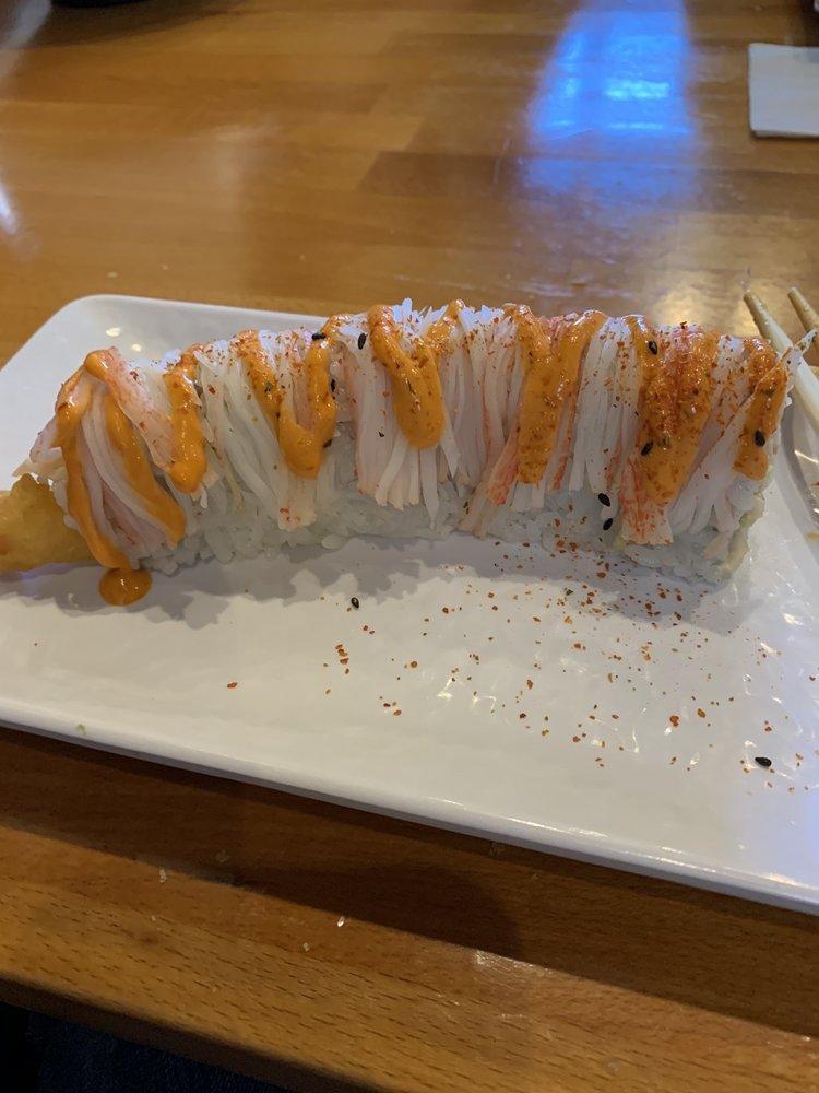 Shaggy Dog Roll · Inside: shrimp tempura and avocado. Top: crab stick, spicy mayo and chili powder.