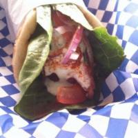 Shrimp Pita Wrap · Grilled shrimp.  Served with red onion, tomato and our special tzatziki sauce. Can be made p...