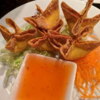 Crab Wonton · Wonton filled with crab meat, cream cheese and scallions, served with a sweet chilli sauce.