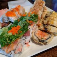Black Widow Roll · Soft shell crab tempura, crab stick, eel, cucumber and avocado topped with masago and eel sa...