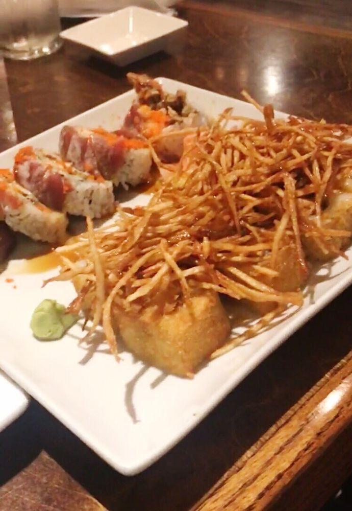 Vegas Roll · Soft shell crab tempura, crab stick, avocado topped with tuna, masago, spicy mayo, wasabi and eel sauce.