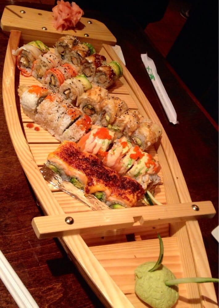 Sushi Boat For 2 Combo · 14 pieces of assorted nigiri, 9 pieces of sashimi and 3 rolls of chef's choices. Served with house salad and miso soup.
