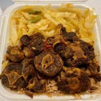 Large Oxtails · Includes rice and peas or white rice and choice of 2 sides.