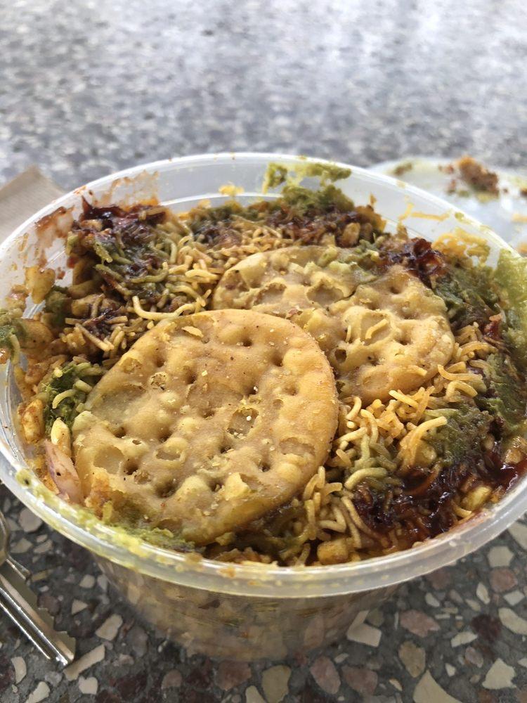 Bhel Puri · Puff rice, onion, cilantro, tomato, chutney.