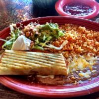 Chimichanga · Stuffed flour tortilla with your choice of chunks of beef or chicken breast cooked with bell...