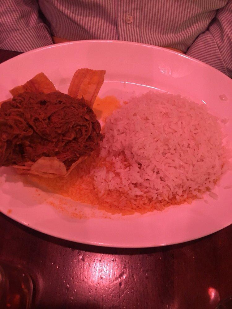 Ropa Vieja · Literally means old clothes. A Cuban classic .Braised shredded beef simmered with tomatoes, bell peppers, olives & sherry wine.