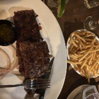 Churrasco Rumbero · Juicy and flavorful skirt steak grilled to perfection and served with our homemade chimichur...