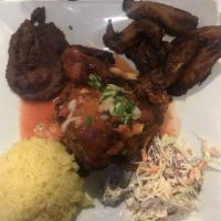 Pollo Frito · Crispy golden brown fried chicken leg thigh. Served with rice, salad, beans. Rice and beans ...